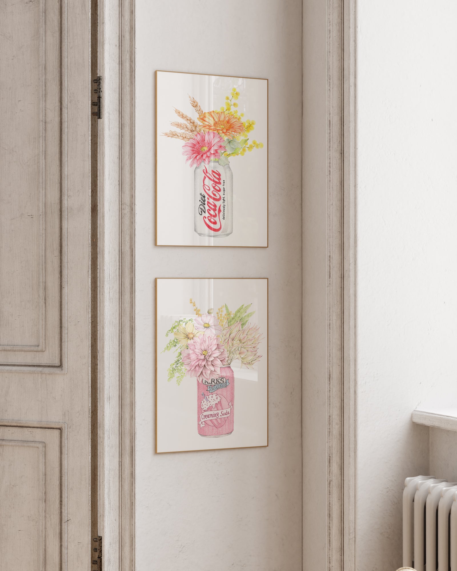 Framed artwork of a Coca-Cola bottle with floral design on a wall.