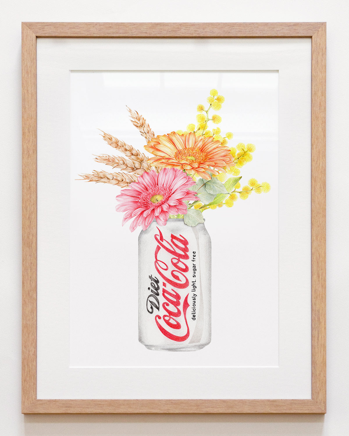 Framed artwork of a Diet Coke can with flowers on a white background