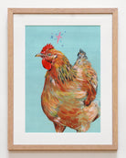 Framed art print of a chicken on a light blue background