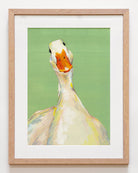 Framed artwork of a goose on a green background