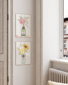 Botanical celebration wall art with flowers in champagne bottle