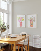 Living room wall art featuring iconic soft drinks and flowers