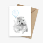 Birthday card featuring an Australian native wombat holding a blue balloon.