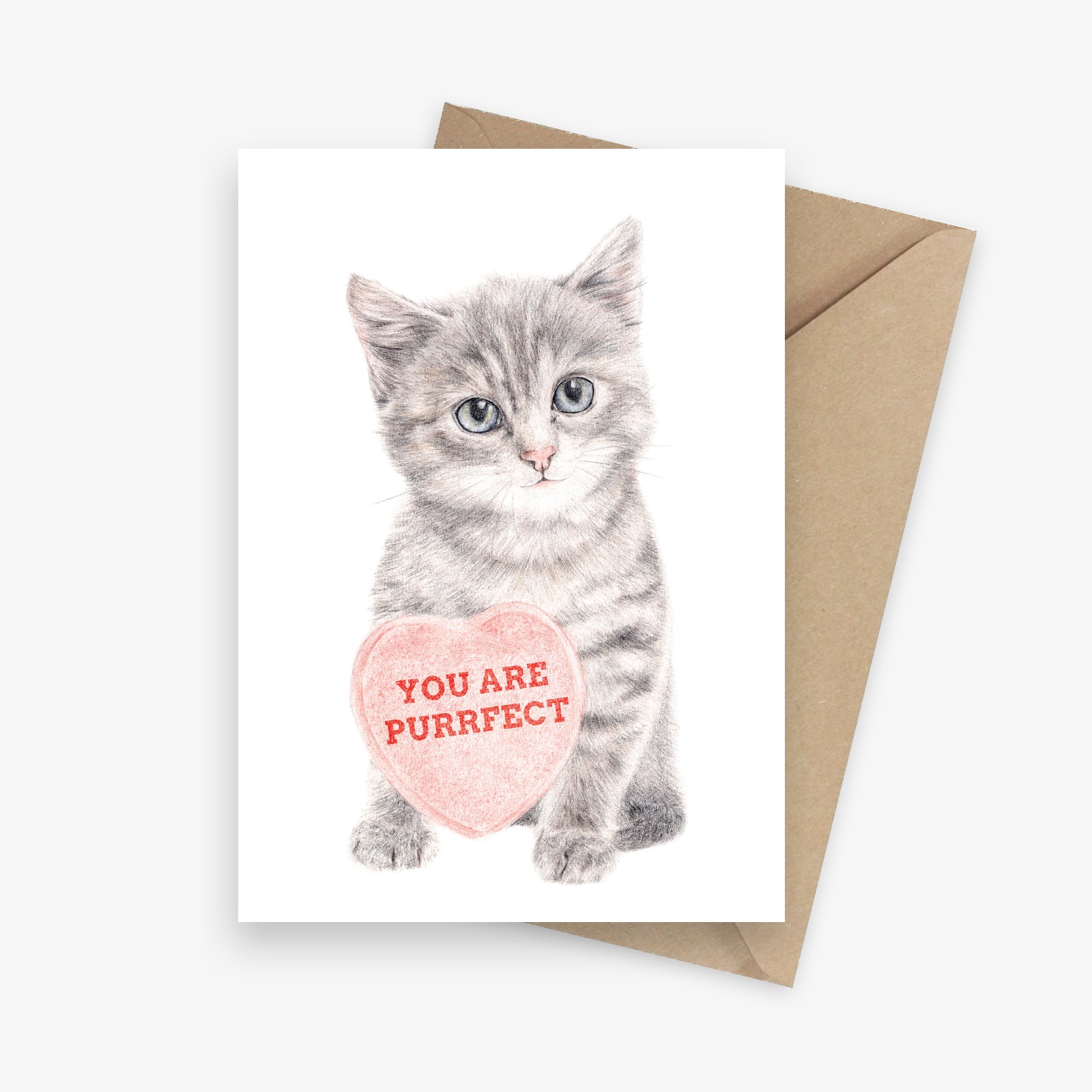 Greeting card featuring a kitten holding a big love heart.